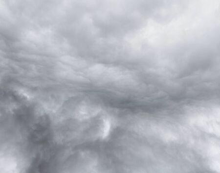 Dark ominous grey storm cloudsの写真素材