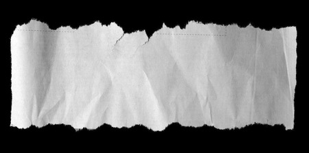 Piece of torn paper on blackの写真素材