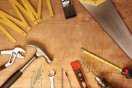 Assorted work tools on woodの写真素材
