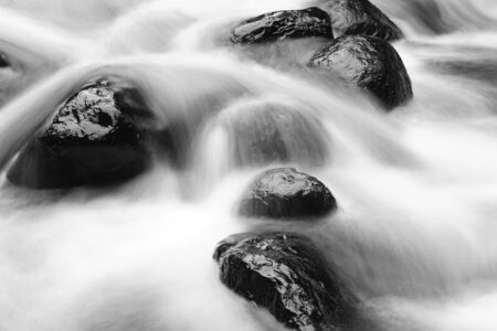 Fast flowing mountain stream and rocks