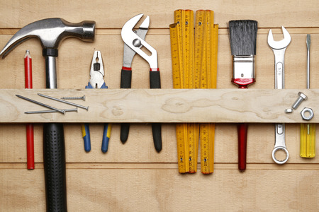 Assorted work tools on woodの写真素材