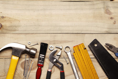 Assorted work tools on wood