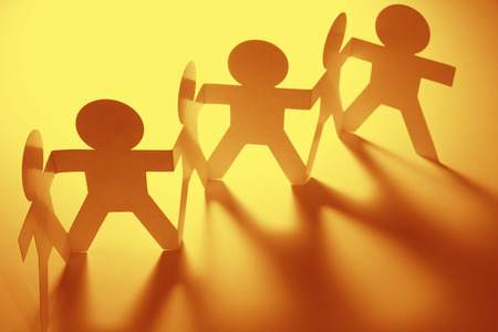 Team of paper doll peopleの写真素材