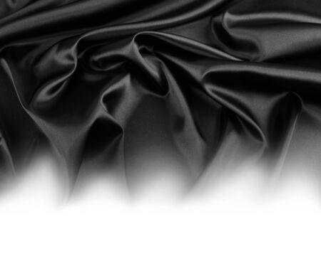 Rippled black silk fabric on whiteの写真素材