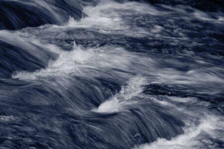 Fast flowing mountain streamの写真素材