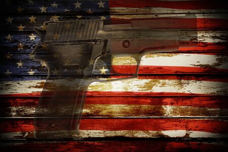 Handgun and American flagの写真素材