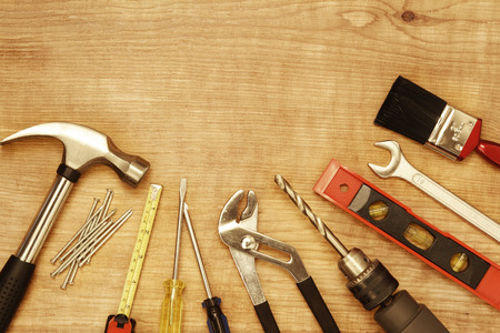 Assorted work tools on woodの写真素材
