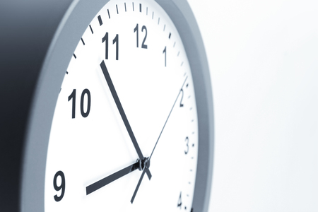 Closeup of hands on clock face