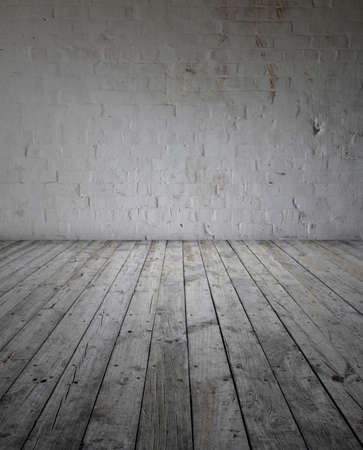 Wooden floorboards and brick wallの写真素材