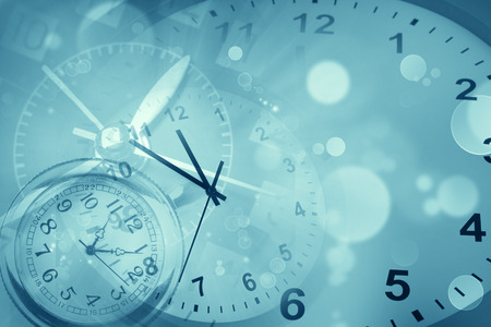 Clocks and abstract blue backgroundの写真素材