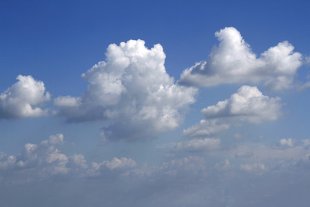Fluffy clouds in a blue sky