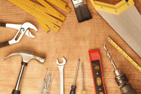 Assorted work tools on woodの写真素材