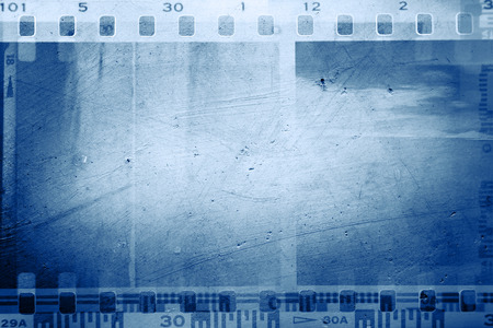 Film negative frames on blue backgroundの写真素材
