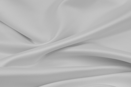 Closeup of rippled white silk fabricの写真素材