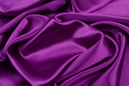 Closeup of rippled purple silk fabricの写真素材