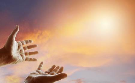 Hands reaching for the skyの写真素材