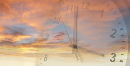 Clock face in bright sky. Time passing