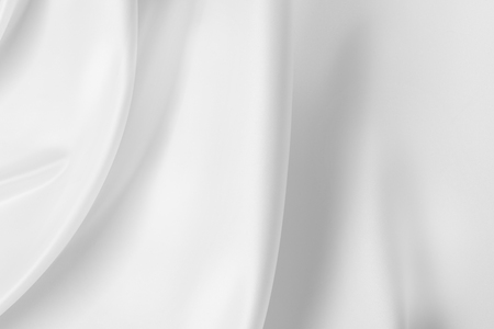 Closeup of rippled white silk fabricの写真素材