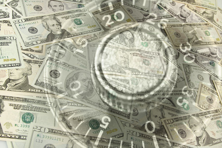 Combination lock dial and American banknotesの写真素材