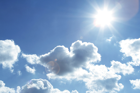 Bright sun shining in cloudsの写真素材