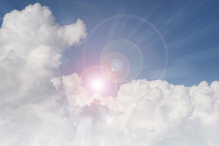 Bright sun shining in cloudsの写真素材