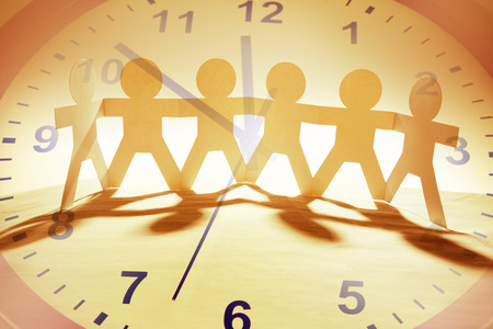 Paper chain team and clockの写真素材