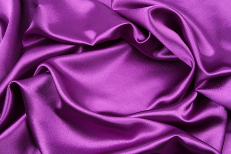 Closeup of rippled purple silk fabricの写真素材