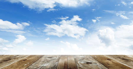 Wooden floor leading to sky 