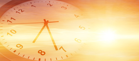 Clock face in bright sky. Time passingの写真素材