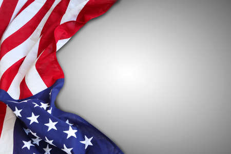 Closeup of American flag on grey backgroundの写真素材
