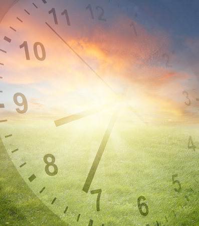 Clock, grass and sky. Spring time