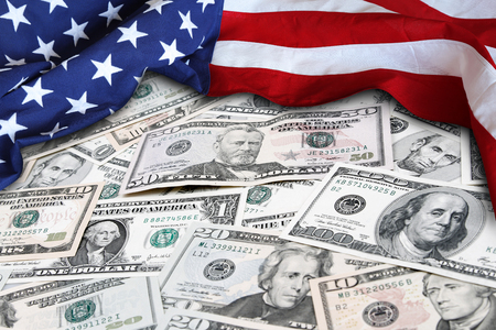 American flag and assorted American banknotesの写真素材