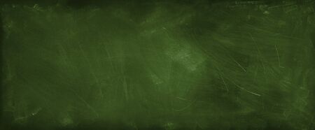 Chalk rubbed out on green chalkboard backgroundの写真素材