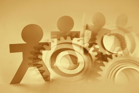 Team of paper chain people and cog gearsの写真素材