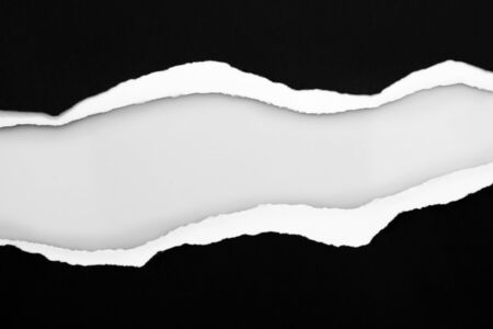 Ripped black paper on plain background, space for copyの写真素材