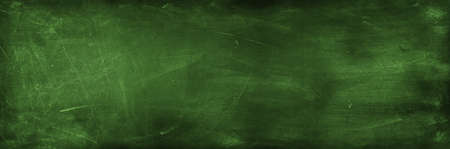 Chalk rubbed out on green chalkboard backgroundの写真素材