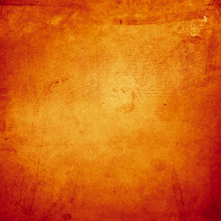 Orange textured concrete wall backgroundの写真素材
