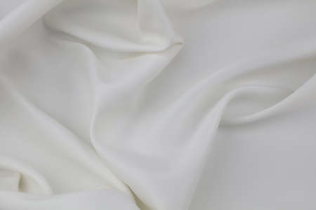 Closeup of rippled white silk fabric linesの写真素材