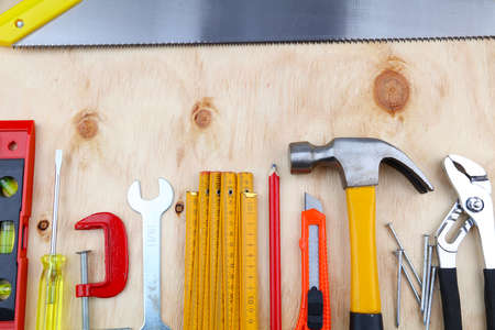 Assorted work tools on woodの写真素材