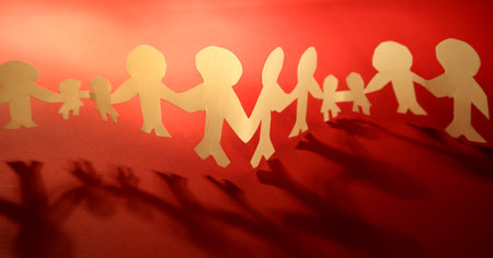 Paper chain team holding hands. Teamwork. Partnershipの写真素材