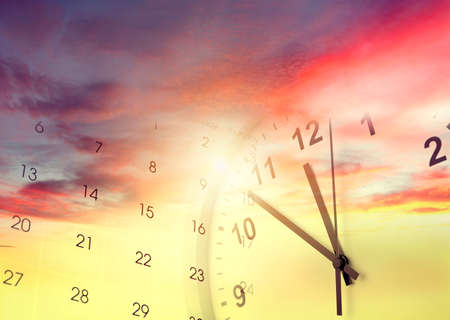 Clock and calendar in bright sky. Time passingの写真素材