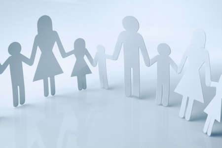 Family paper chain cutout holding handsの写真素材
