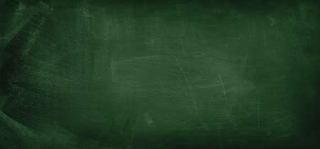 Chalk rubbed out on green chalkboard backgroundの写真素材