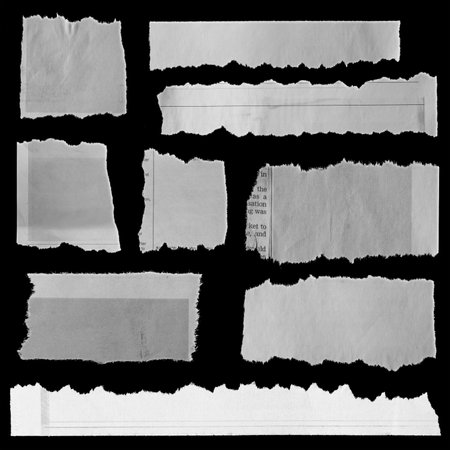 Nine pieces of torn newspaper on black backgroundの写真素材