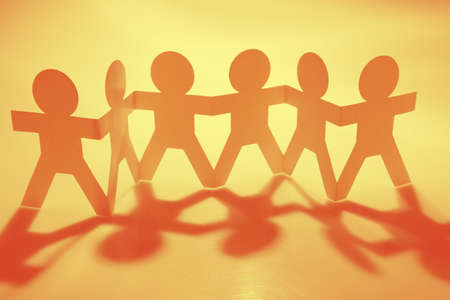 Paper chain team holding hands. Teamwork. Partnershipの写真素材