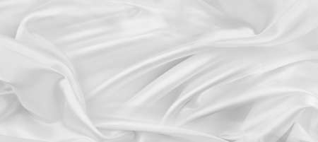 Close-up of rippled white silk fabric textureの写真素材