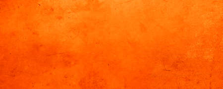 Orange textured concrete wall backgroundの写真素材