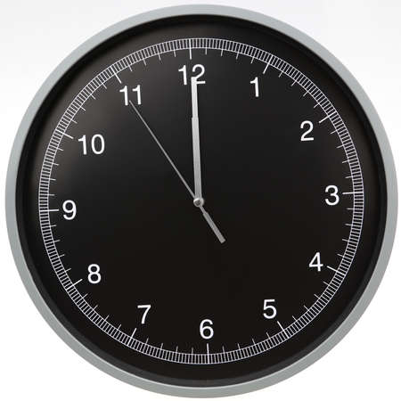 Wall clock showing twelve o'clock isolated on white backgroundの写真素材
