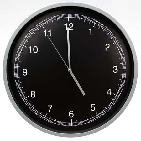 Wall clock showing five o'clock isolated on white backgroundの写真素材