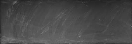Chalk rubbed out on blackboard backgroundの写真素材